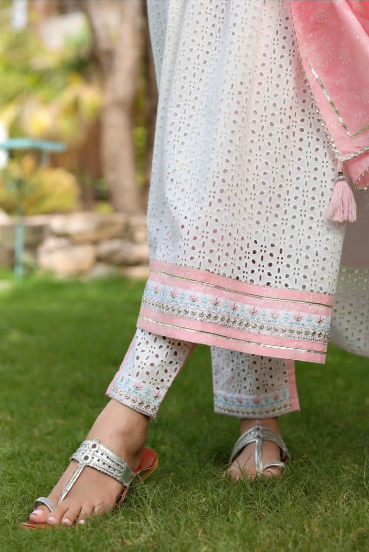 A Cotton Nyra cut kurti with lining embroidery & gota lace.