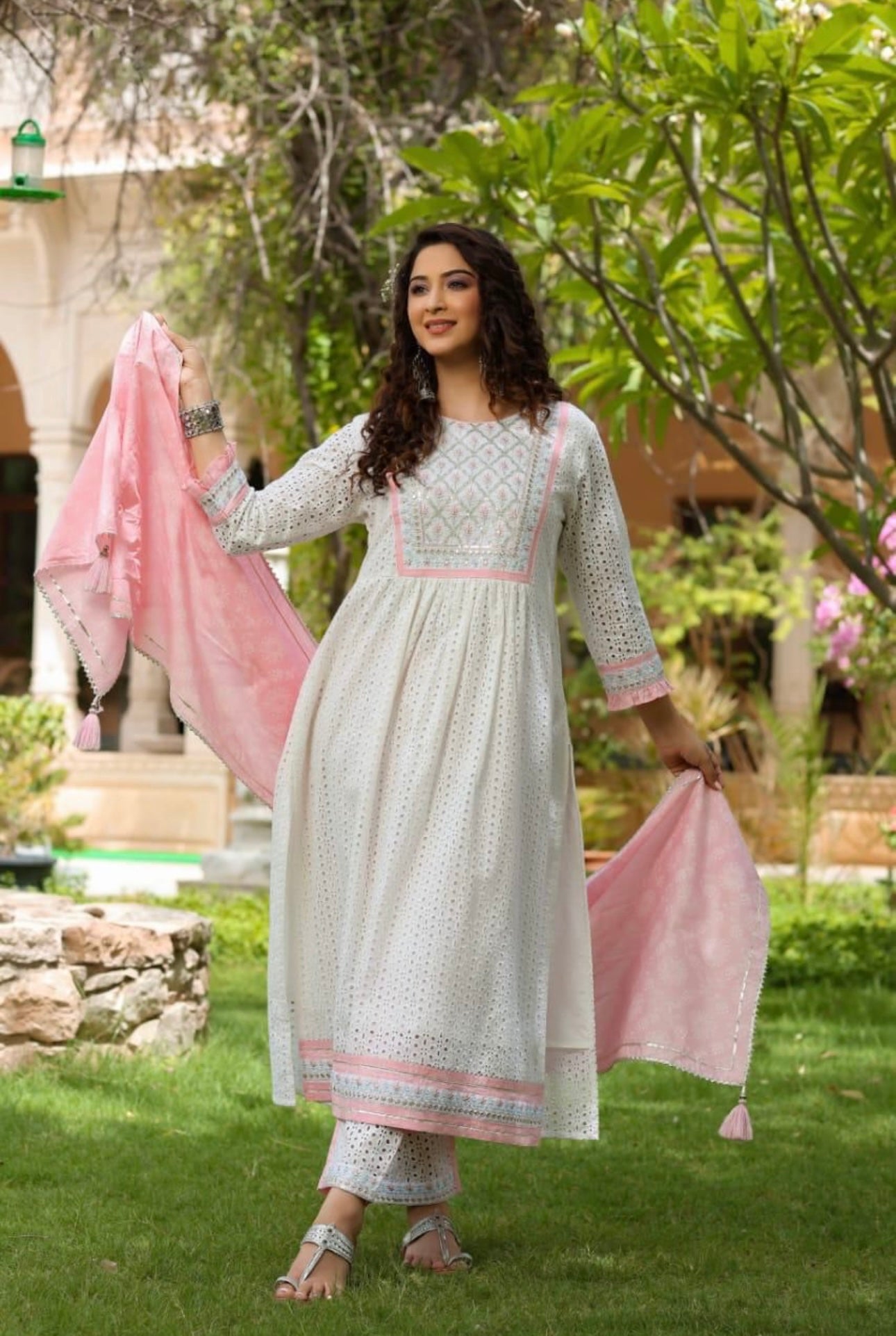 A Cotton Nyra cut kurti with lining embroidery & gota lace.